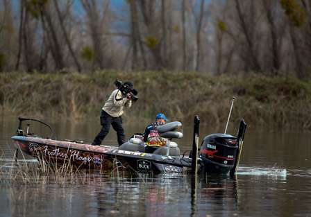Bill Lowen hooks up with a good fish and moves to the driver's seat to land it.
