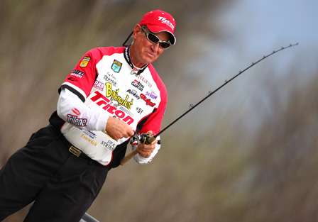 Guy Eaker is fishing the same area as Lowen, using a different bait to catch his fish.