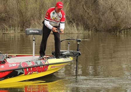 Guy Eaker fights a bass near the boat on the final day of competition.