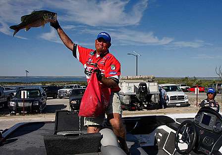 Clark Reehm holds up a Lake Amistad hawg which would threaten Faircloth's place in the hot seat. Reehm finished second, within 12 ounces of Faircloth.