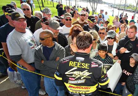Skeet Reese spends time signing autographs after coming up one ounce short in his quest for the tournament title.
