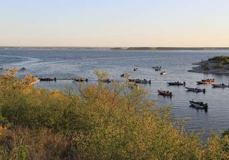 An arch of bass boats make their way toward the launch line at Diablo East on Lake Amistad.