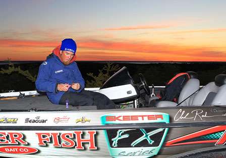 Day One co-leader Clark Reehm reties his baits as the sun starts to rise behind him over the beautiful Texas landscape.