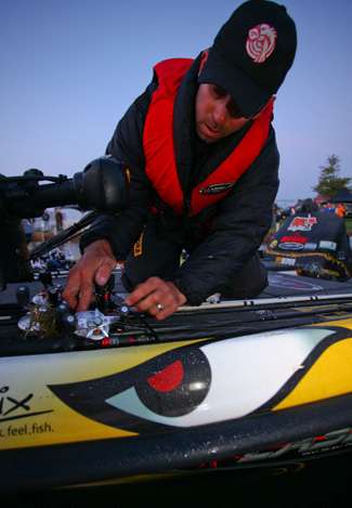 Mike Iaconelli straps his rods on the front deck of his boat. 