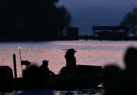 An angler begins to pull his rods from the rod locker in the dark before starting Day One of the Blue Ridge Brawl. 