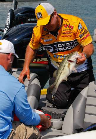 Terry Scroggins sacks the fish that would bump him to 3rd place at the end of Day Two on Smith Mountain Lake. 