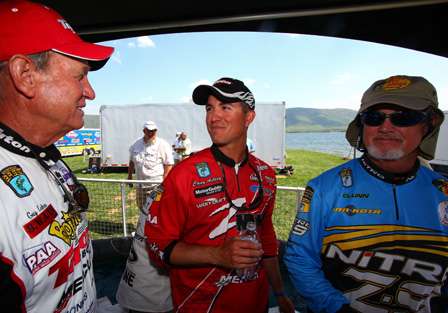Guy Eaker, Casey Ashley and Rick Clunn visit before taking the stage to weigh their Day Two catch. 