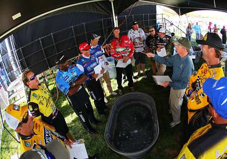 BASS Tournament Director Trip Weldon goes over instructions for the 12 anglers that will fish on Sunday. 