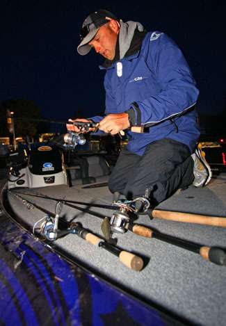Marty Robinson uses the time before take-off to get a few rods together in preparation for fishing Smith Mountain Lake.