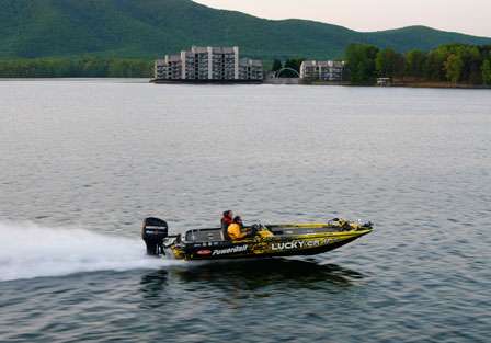Skeet Reese runs across the lake early on Sunday morning, hoping to take the title in Virginia.