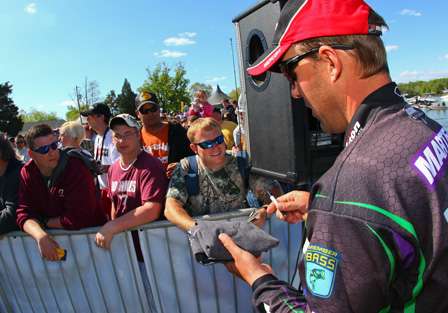 Aaron Martens signed autographs while waiting to bring his fish to the scales. 