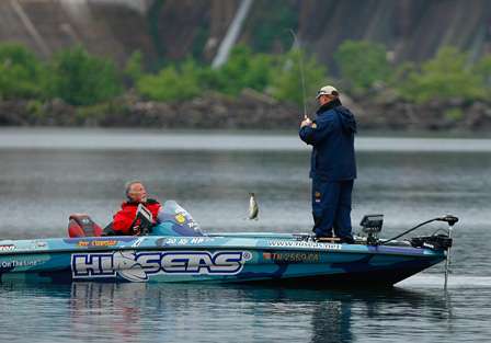 Jeff Conella pulls a fish into the boat. 