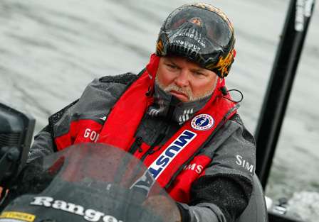 Tommy Biffle idles toward the dock in the pouring rain after his day of fishing on Pickwick Lake.