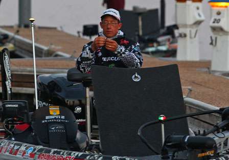 Charlie Hartley ties on a lure before the start of the first day of competition.