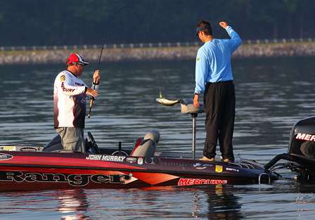 John Murray flips another fish over the side of the boat and his Day Two Marshal gets a great view of the action. 