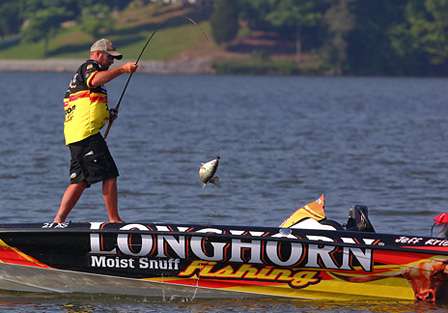 Kriet swings a sizeable Lake Guntersville keeper into the boat. 