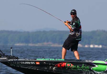 Roumbanis turns to tell ESPN photographers he is hooked up with a big fish. 