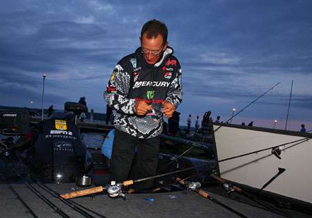 Charlie Hartley spends a few minutes rigging up for the day of fishing after making his second consecutive 47-cut.