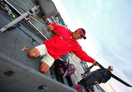 Legendary deep-cranker Paul Elias takes the cover off a rod as he gets his tackle ready for the third day of competition.
