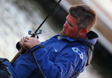 In the second flight, Clark Reehm uses the extra time to prepare his tackle for the day ahead.