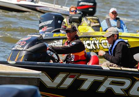 Kevin VanDam looks for a place to pull into the dock as Skeet Reese waits just in the distance.