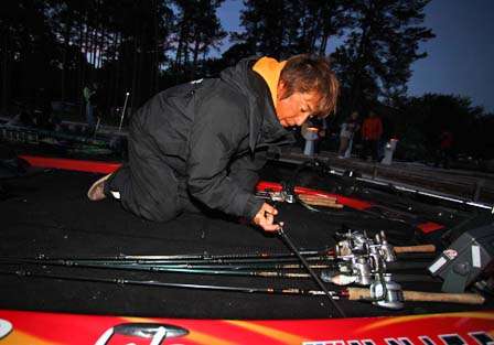 Morizo Shimizu straps down his rods before takeoff.
