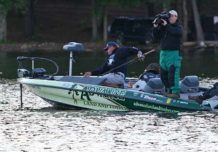 Davy Hite begins pulling rods from the rod locker to try and finish the deal on Lake Guntersville.