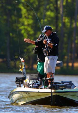 Hite pulls another fish into the boat on a crankbait. 