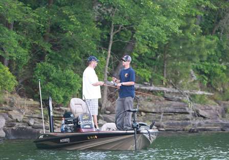 Pro Trevor Knight and co-angler Jeffery Brooks appear to be facing each other as they work a rocky bank on Smith Lake.