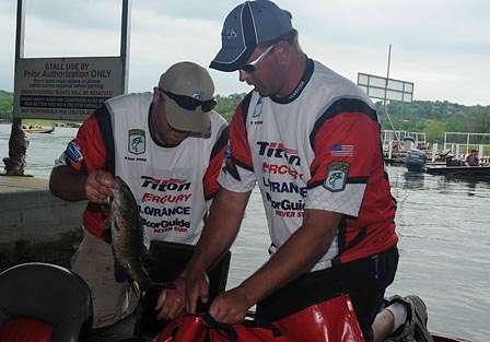 Missouri's Rand Woods (left) and Nebraska's David Fuhr load up their fish.