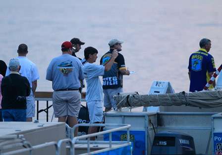 Fans and family gather at the dock to take photos and cheer on the anglers as they take to Smith Lake on Day Two.