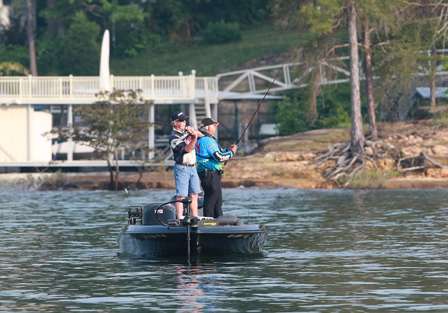 Pro David Kelley fires a shot from the bow of his boat as he allows his co-angler Bill Bonner plenty of water to fish.
