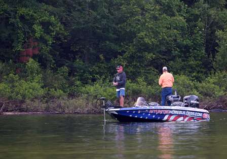 Steve Daniels works his way along a shallow bank up a creek arm, ... 
looking for the 