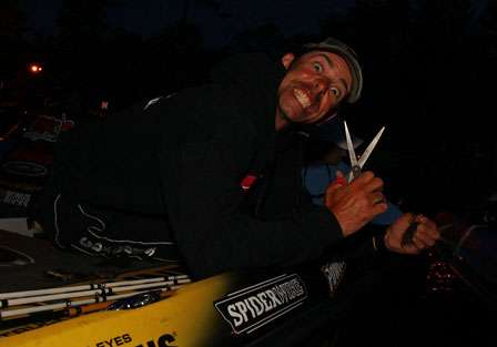 Mike Iaconelli gives a menacing glance to the camera as he modifies a lure early Thursday morning.