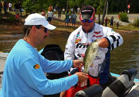 Kenyon Hill sacks his fish at the end of Day One. Hill is in 14th place with 13 pounds, 9 ounces.