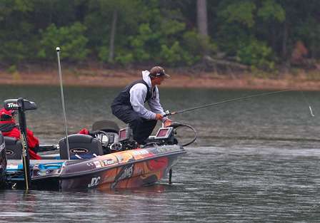Kevin Wirth reaches for another rod as fish start schooling on the point he was fishing. 