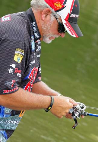 Tommy Biffle wraps his rods up after a tough day of fishing on Clarks Hill Lake.
