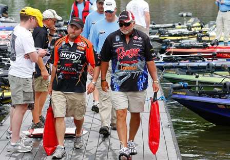 Mike McClelland and Tommy Biffle carry their bags down the dock and up to the weigh-in.