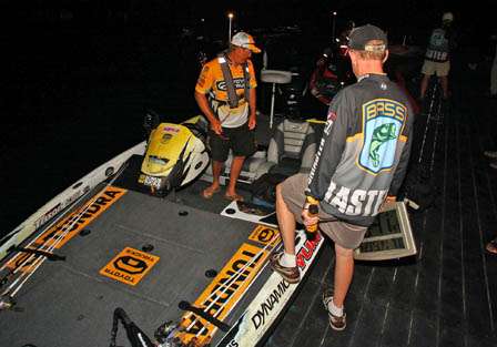 Trip Weldon, Bassmaster Tournament Director, goes over last-minute instructions with Terry Scroggins before take-off.