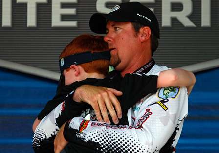 Jason Williamson hugs his son after finding out he was the champion of the Pride of Georgia.