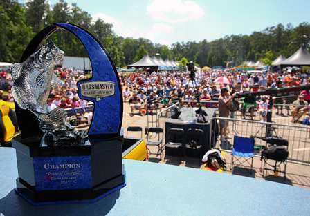 The champion's trophy waits to be claimed, and a packed crowd at the Wildwood Park weigh-in waits for the show to begin.

