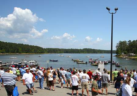 A crowd gathers around the docks as anglers wait to pull their boats out Sunday.