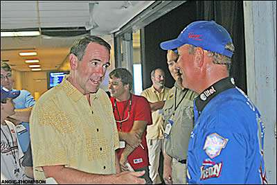 Scott Rook is congratulated by Arkansas Governor Mike Huckabee.