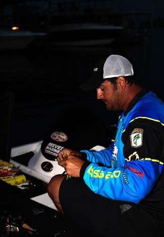 Pro Mike Pharr makes his bait selection and reties as he waits for the Day Two launch to begin.