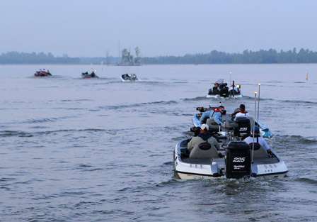 The first flight of anglers take to the waters of Port Lake as they make their way out onto the Red River. 