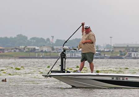 Pro Bill Watts pulls the trolling motor as he readies to move to another part of Port Lake, a small backwater where Red River Marina is located.