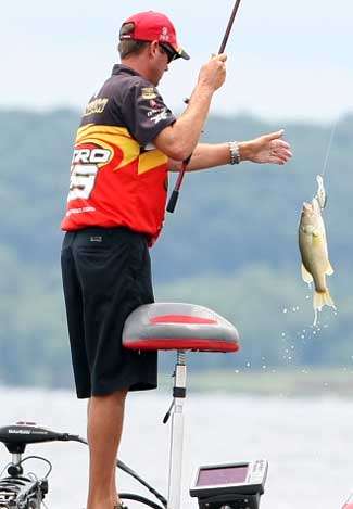VanDam pulls another fish into the boat on his favored crankbait, a Strike King 