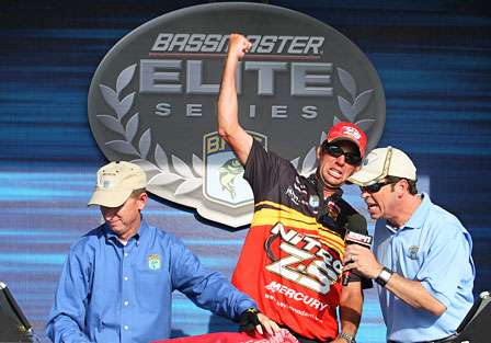 Kevin VanDam's winning weight is announced, and the 14-time BASS winner celebrates with a fist-pump.