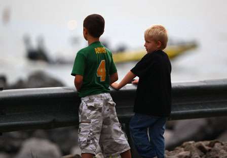 Two young fans watch as the Elite Series anglers depart Paris Landing State Park early Wednesday morning.
