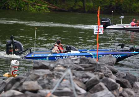 Yusuke Miyazaki idles through the off-limits area and out onto Kentucky Lake for Day One of the Tennessee Triumph.